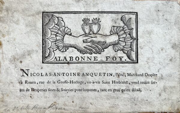Belle carte publicitaire du XVIIIe du drapier rouennais Nicolas-Antoine Anquetin, ornée d'une fides